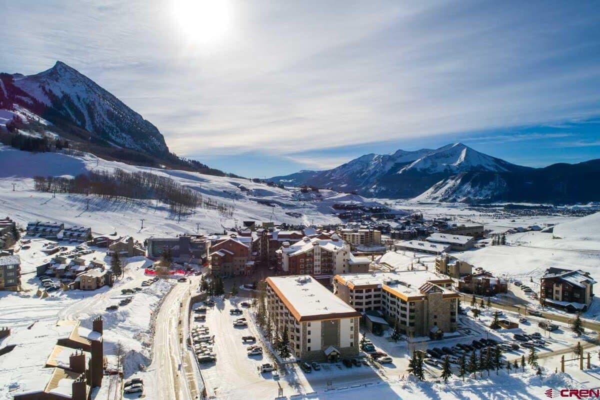 【Winter Exterior】 Mt. Crested Butte in full season — the lifts start just past the lodge