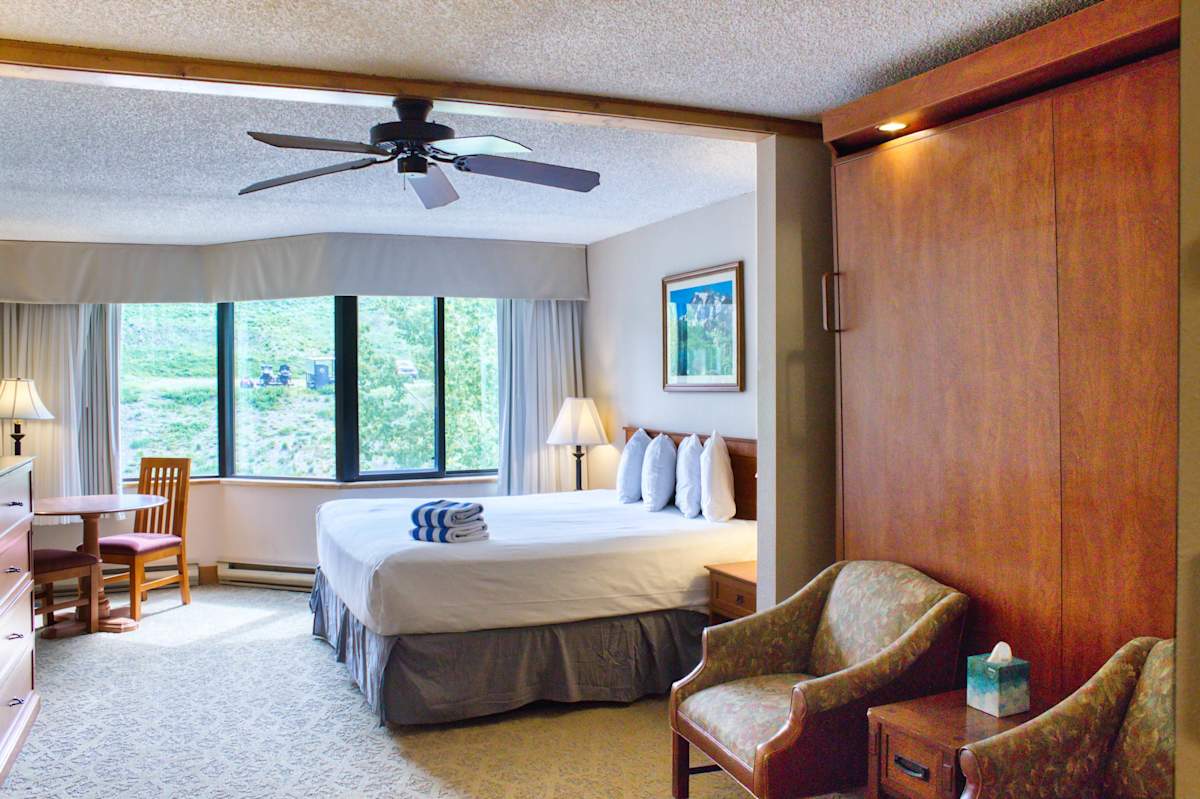 King bed, sitting area and murphy bed | Listed with @BookTraverse