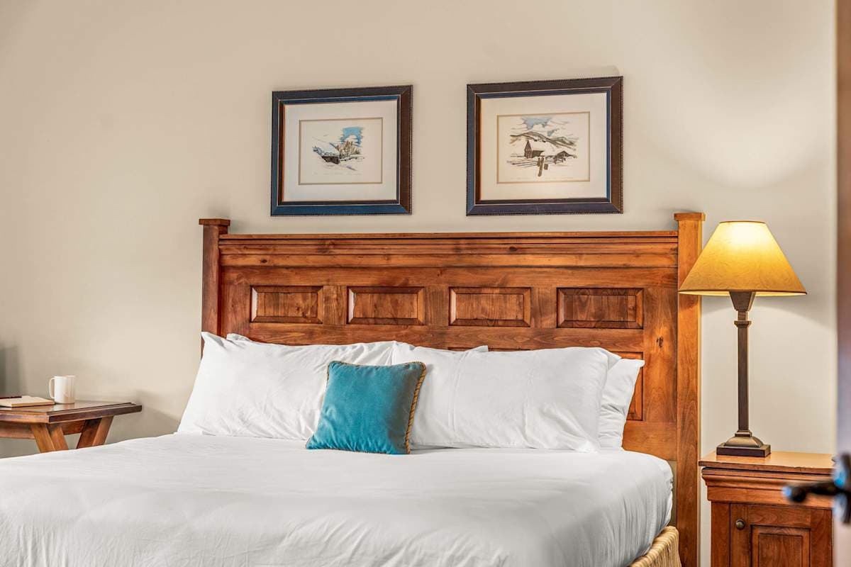Comfortable King Bed with sliding glass doors to balcony | Listed with @BookTraverse