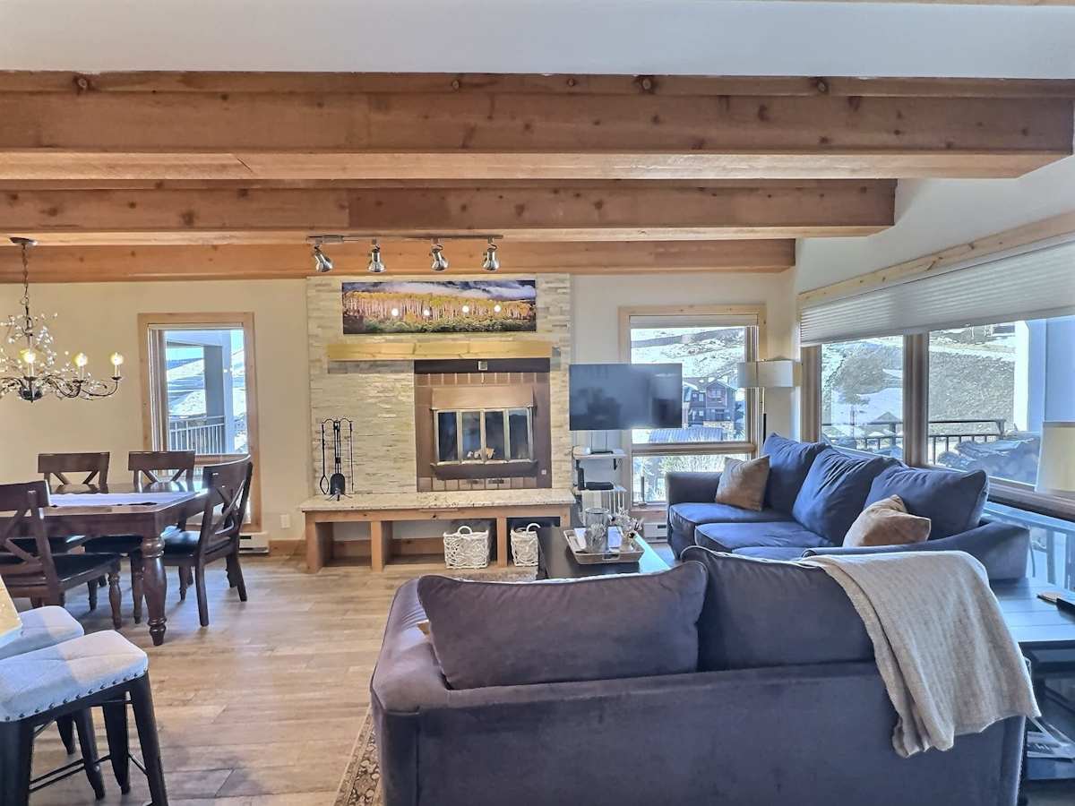 open-concept living area with a fireplace