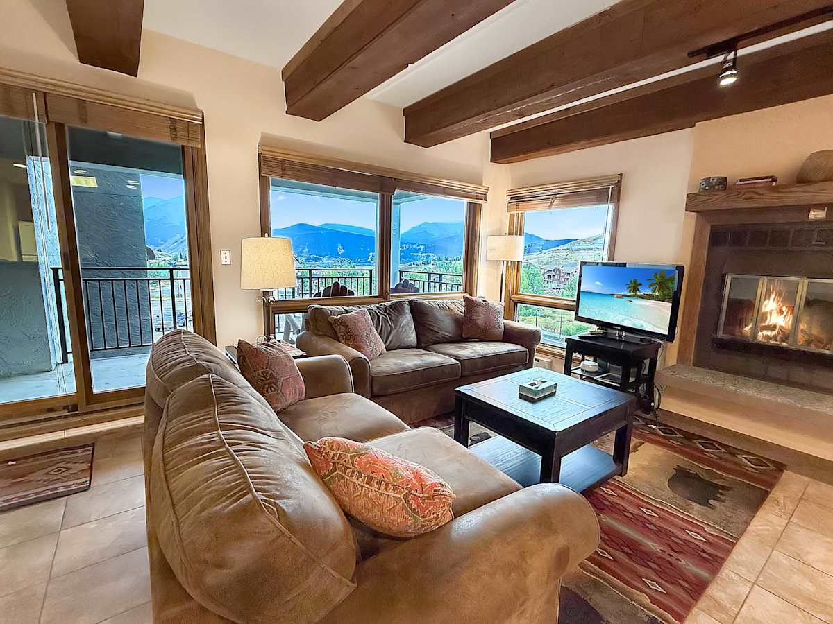 Open Concept living with Wood Burning Fireplace and mountain views | Listed with @BookTraverse
