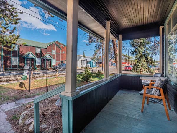 【Front Porch】 Covered porch seating — coffee in the morning, drinks in the evening