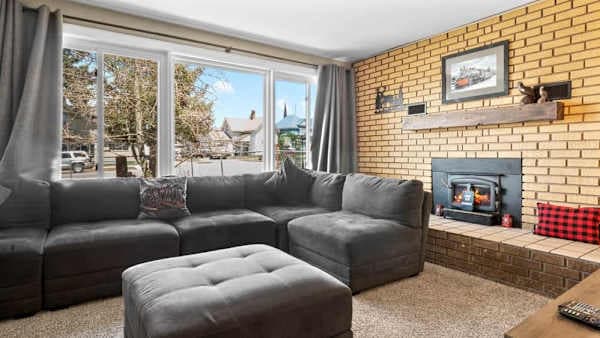 【Living Room】Living Room — Gas Fireplace + Sectional for the Full Household