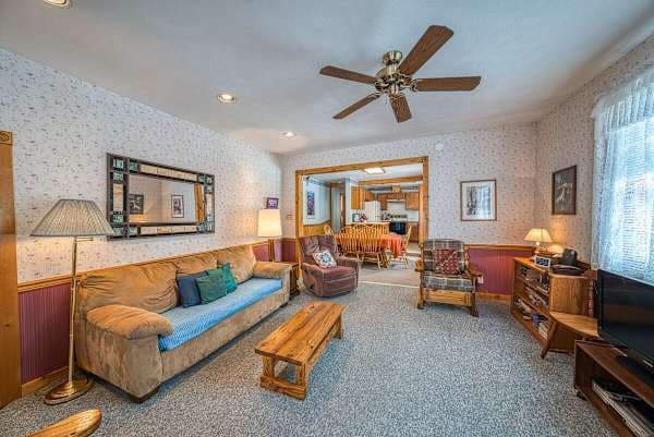 【Living Room】 Wood stove anchors the main floor — winter heat source.