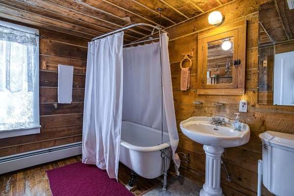 【Bathroom】 Claw-foot tub — original Victorian detail kept through the remodel.