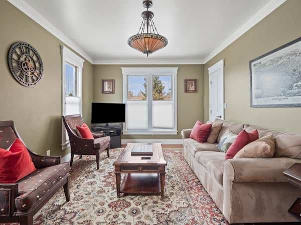 【Living Room】 One of two living rooms — upstairs and down each have their own TV.