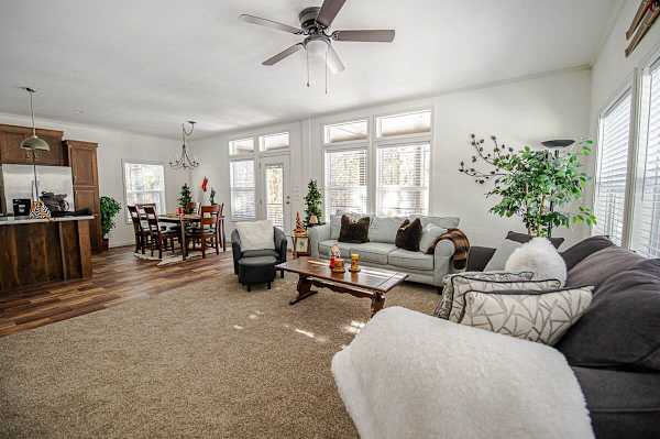 【Living Room】 Open plan with large windows onto the trees — where the crew lands after a ski day.