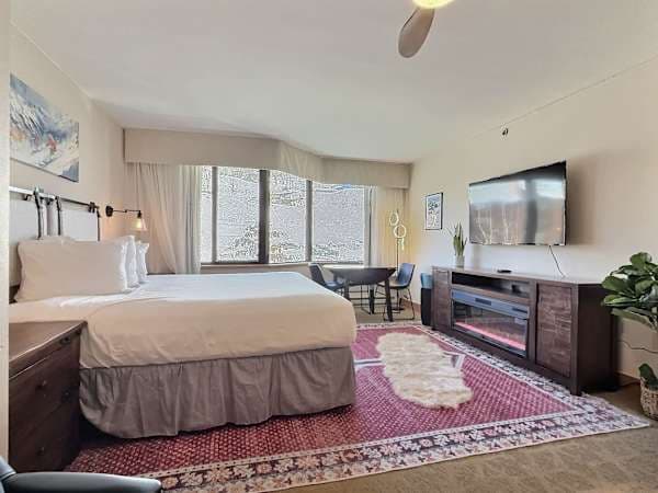 Bedroom with Cozy electric fireplace | Listed with @BookTraverse