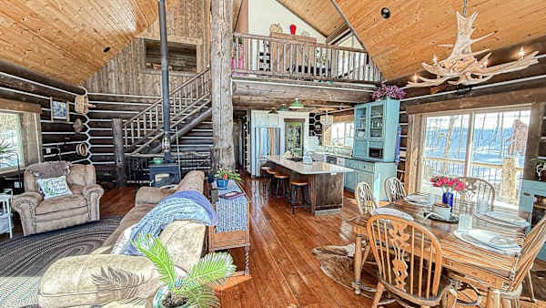 【Main Floor / From the Loft】 Cathedral ceilings, wall of glass at the mountains, dining for 6 below