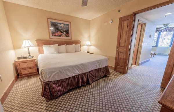 【King Bedroom】 Separate door closes for privacy — uncommon in a studio