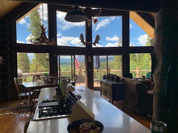【Main Floor】 The wall of glass that gives the A-frame its name — Mt Elbert and Mt Massive on the horizon