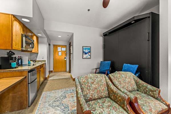 【Sitting Area】Lounge spot with electric fireplace — A/C in unit, rare at Grand Lodge