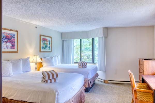 【Bedroom】Two real queen beds and a door that closes — not a studio nook