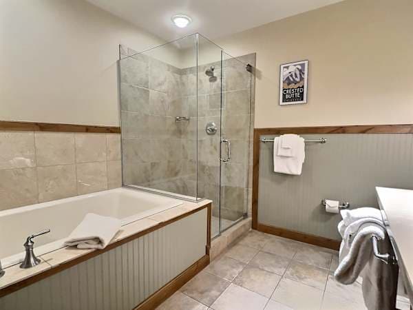 Soaking Tub and Glass Shower in spacious bathroom | Listed with @BookTraverse