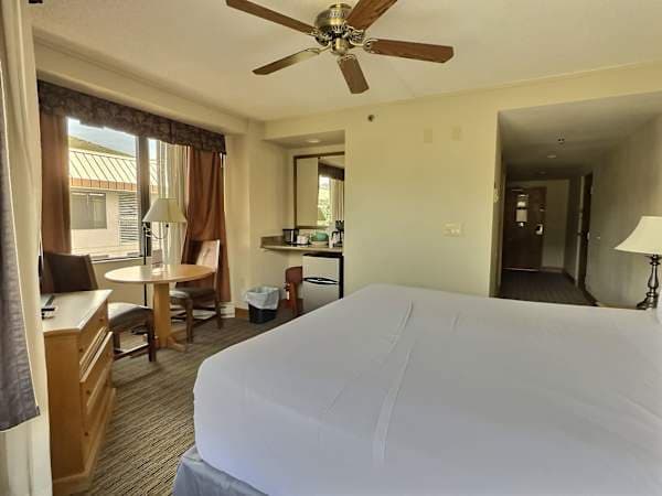 Kind room with Coffee maker and small table | Listed with @BookTraverse