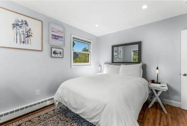 【Bedroom 1】Queen bed and a mounted smart TV — your quiet corner