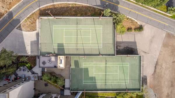 【Courts — Aerial】Full view of both courts — tennis + pickleball, steps from the lobby