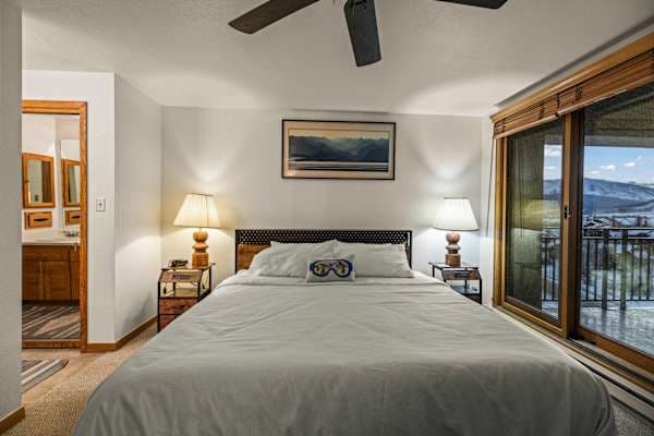 【Bedroom 1 — Primary King】King w/ ensuite bath + balcony access — parents' pick