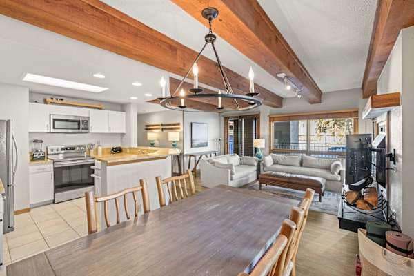 【Living + Mountain View】 Open layout, balcony slider behind you — that's the resort out the window. | @BookTraverse