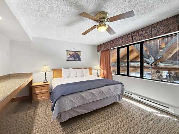 【King Bedroom 2】Morning light off the timber frames, built-in counter for a laptop
